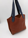 Handmade leather tote with floral design