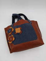 Handmade leather tote with floral design